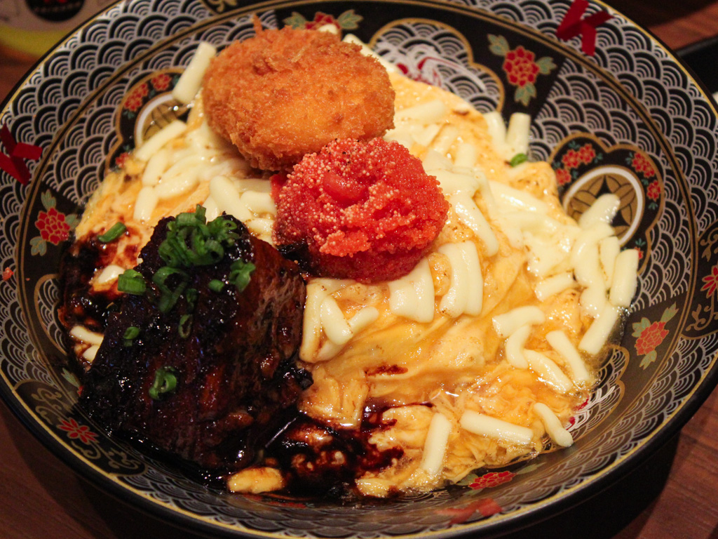 A regular-sized bowl of egg rice with some familiar toppings you’ll also find at its Bugis+ outlet. Photo: Angeline Ang/HungryGoWhere scrambled egg rice keisuke millenia walk