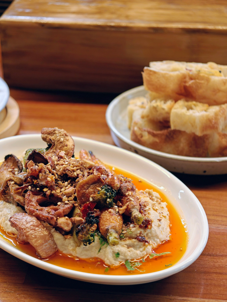 Hummus with garlic bread in the background. Photo: Zawani Abdul Ghani/HungryGoWhere artichoke pizza parlor refreshed menu