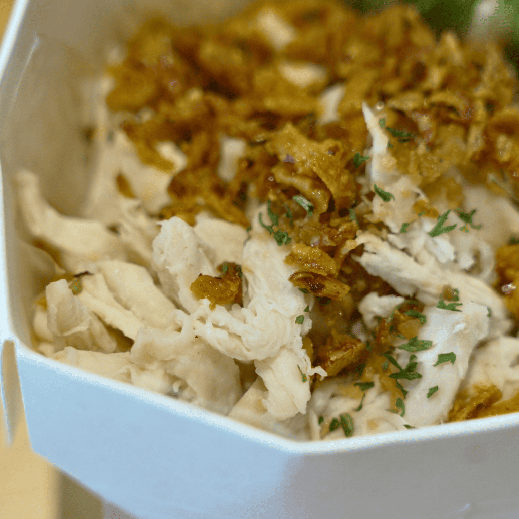 Enjoying the tasty noodles. Photo: Ewan Lim/HungryGoWhere emily chicken noodle grab singapore
