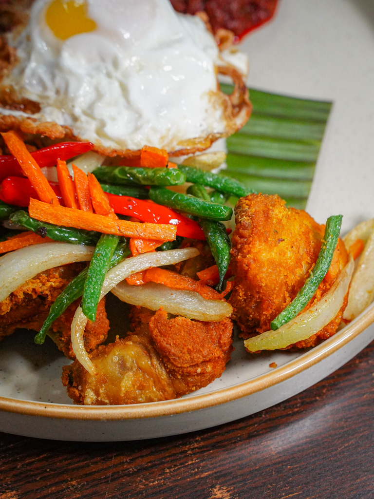 The ayam kunyit was a less spice-forward fried-chicken option. Photo: Evan Mua/HungryGoWhere kitchenman nasi lemak