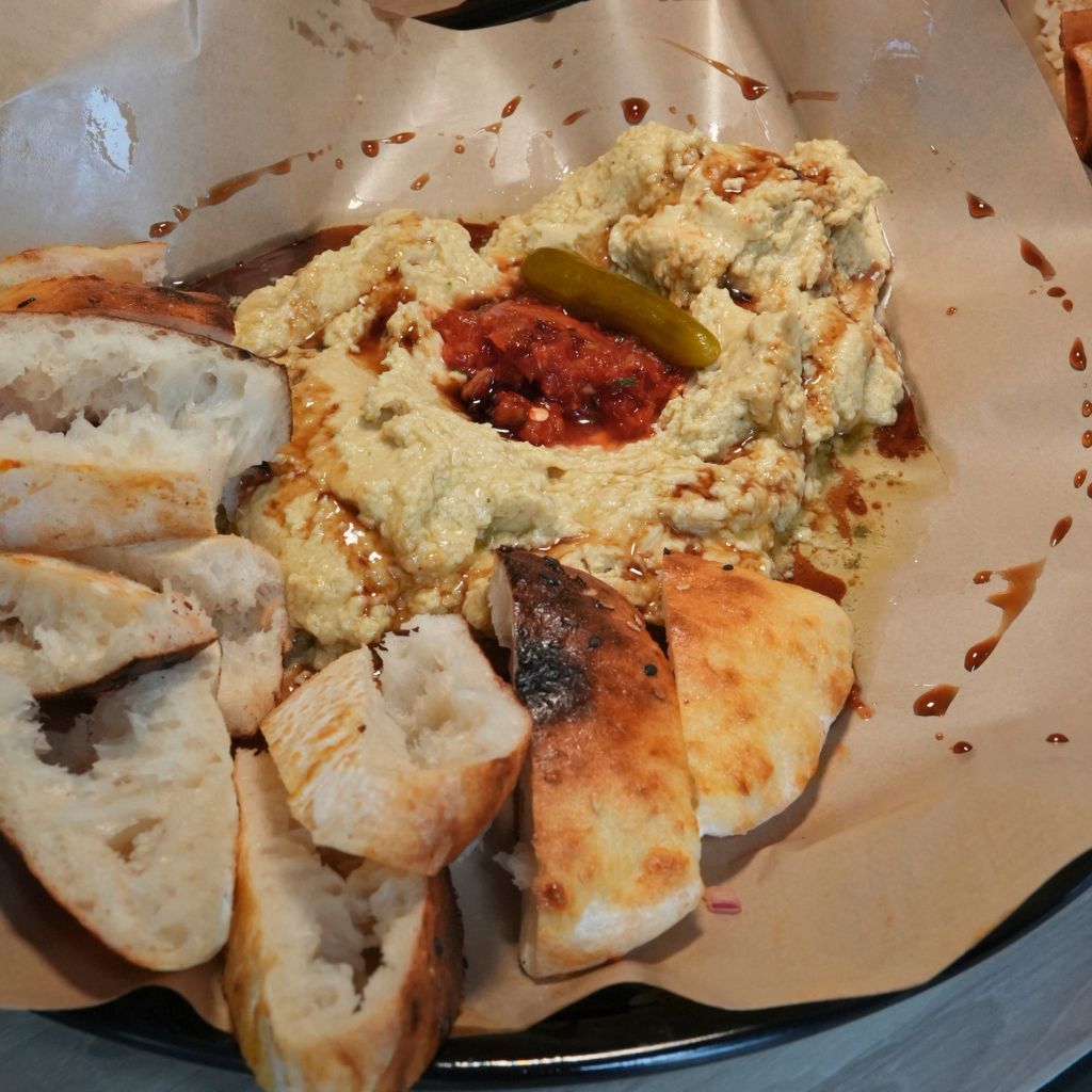 The chickpea puree is topped with a small dollop of vibrant-red shatta sauce. Photo: Shannon Yap/HungryGoWhere daddy cuisine by daddy bbq holland village
