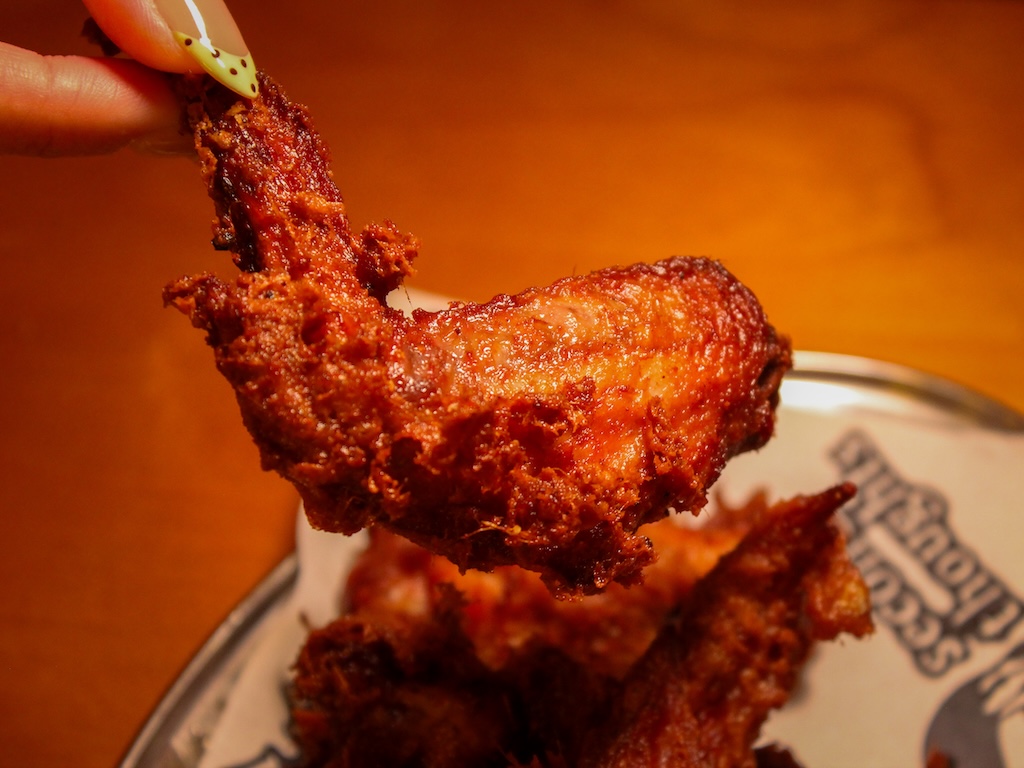 The rempah wings pair perfectly with a cold beer. Photo: Angeline Ang/HungryGoWhere second thoughts jalan besar