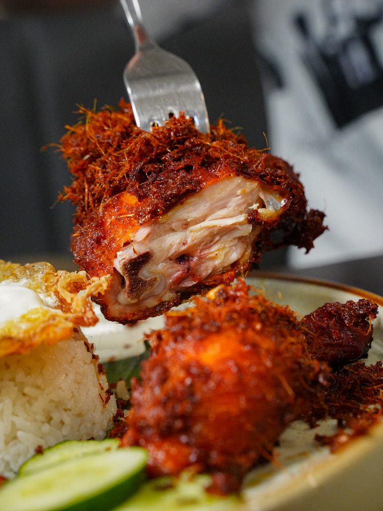 One of the best ayam goreng berempah we’ve had. Photo: Evan Mua/HungryGoWhere kitchenman nasi lemak