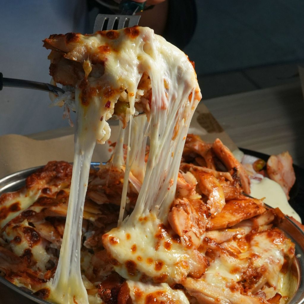 Just look at that satisfying cheese pull! Photo: Shannon Yap/HungryGoWhere daddy cuisine by daddy bbq holland village