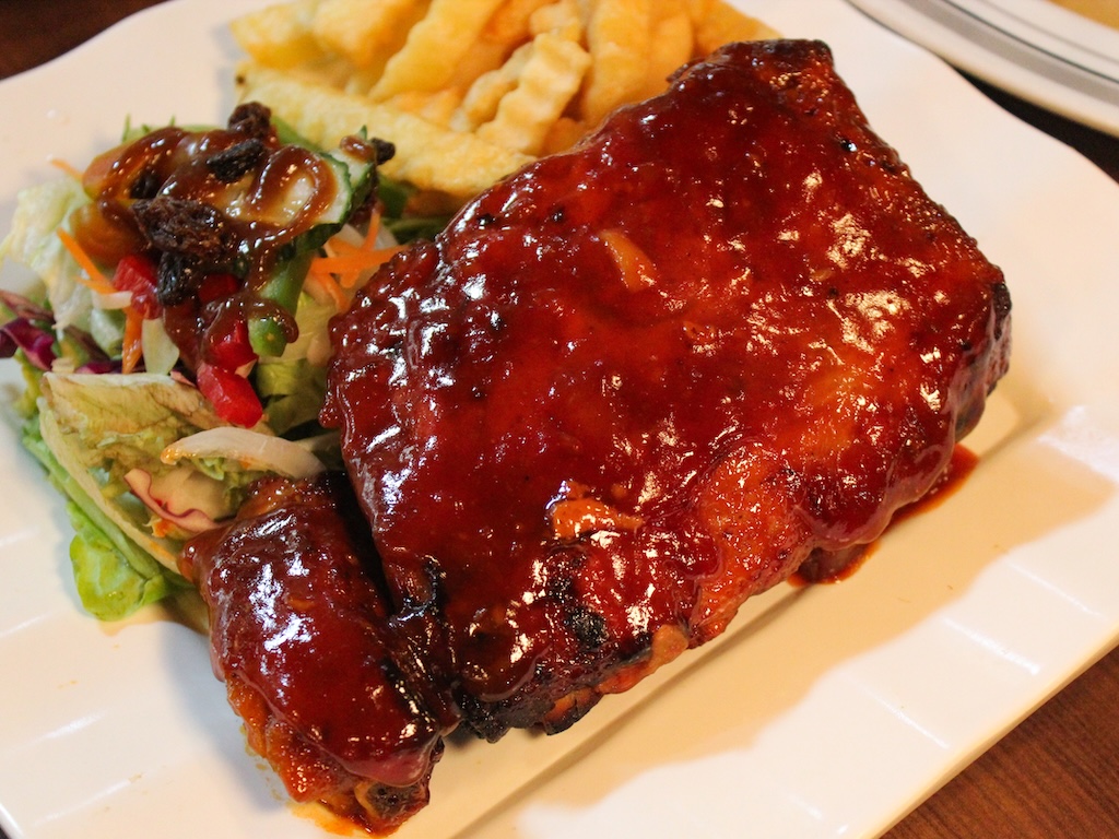 Tender, fall-off-the-bone BBQ pork ribs slathered in a sweet barbecue sauce. Photo: Angeline Ang/HungryGoWhere Tim's Restaurant And Cafe