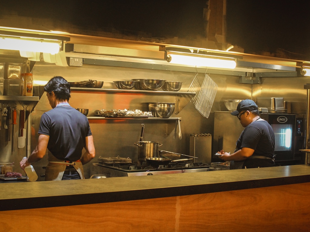 The open-kitchen concept lets you watch the kitchen in action towards the back of the bar. Photo: Angeline Ang/HungryGoWhere second thoughts jalan besar