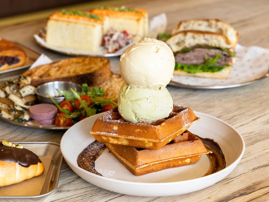 Two scoops of ice cream, pistachio and sea salt gula Melaka, on a stack of Belgian waffles. Photo: Koh Mui Fong/HungryGoWhere creamier ice cream singapore