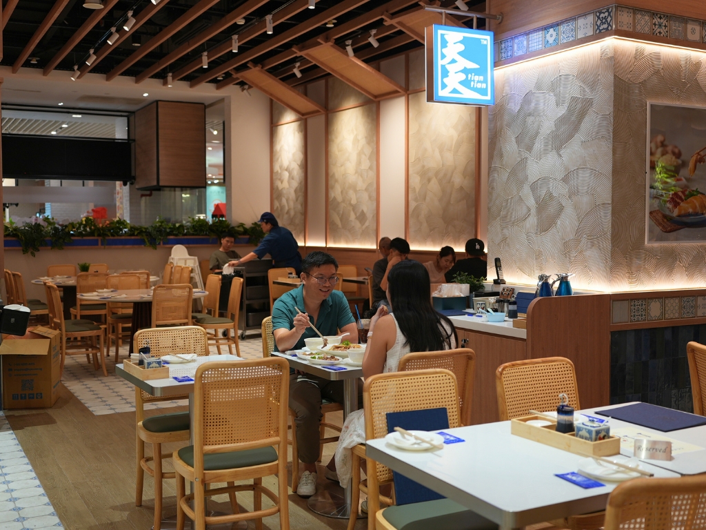 The space is tastefully styled with rattan chairs and warm ambient lighting. Photo: Shannon Yap/HungryGoWhere tian tian hainanese chicken rice jewel changi