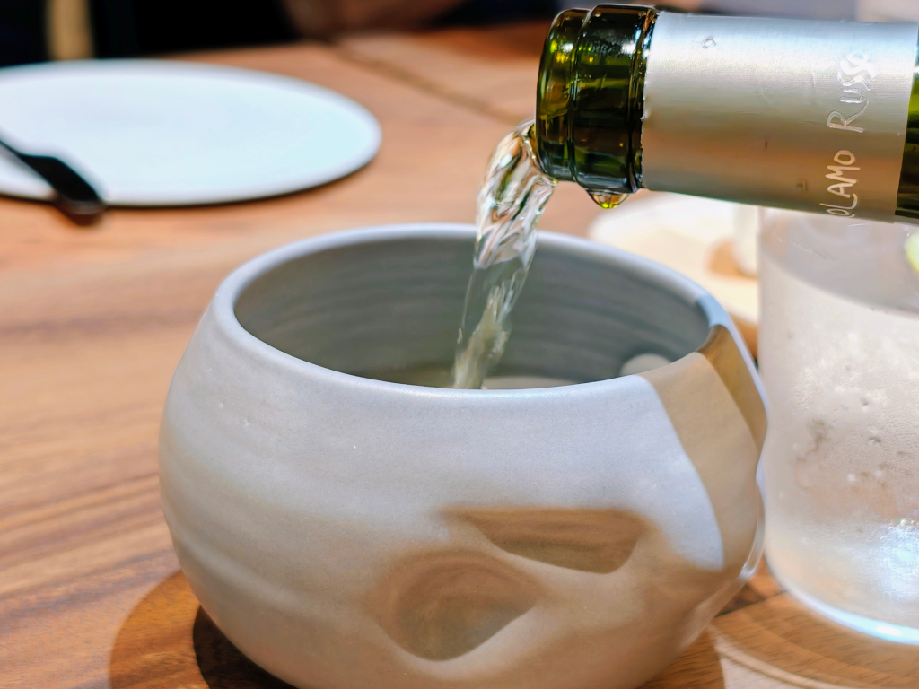 To mirror the restaurant’s philosophy of imperfection, the wine “cups” are handmade pottery, with indented grips. Photo: Zawani Abdul Ghani/HungryGoWhere assagi