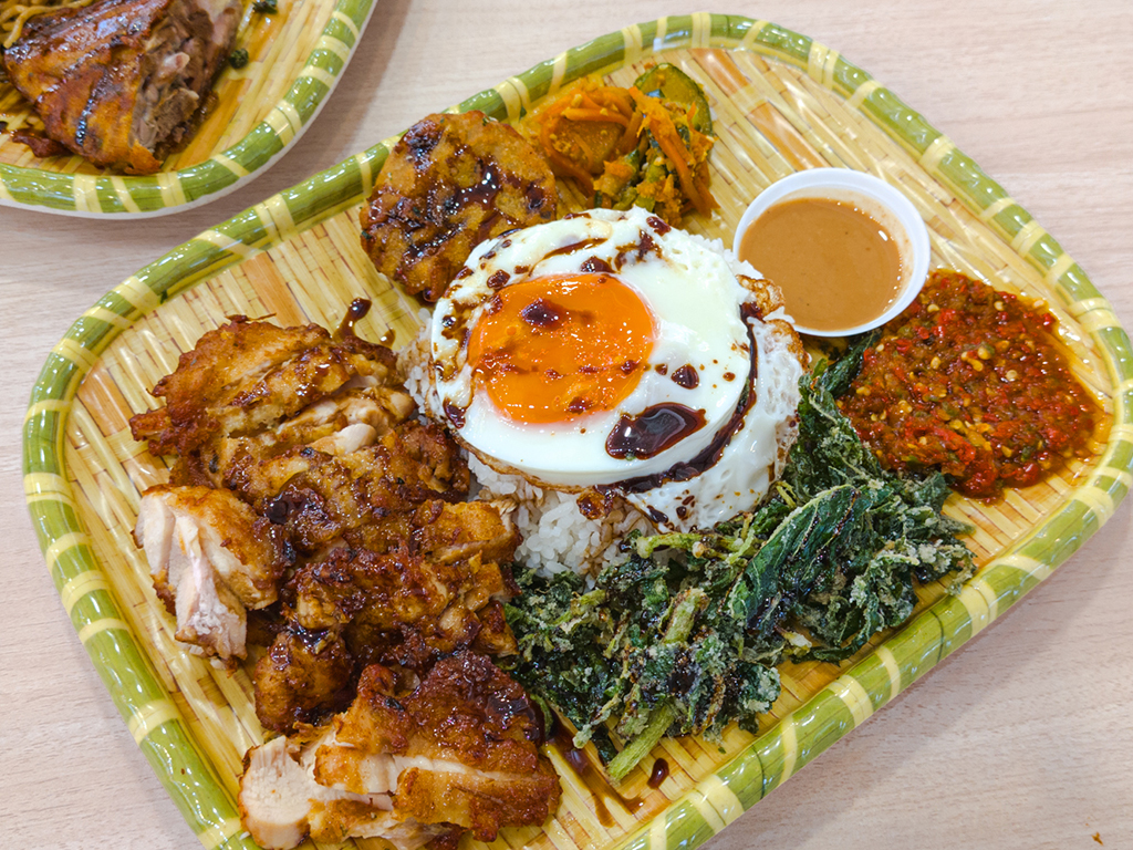 The signature ayam berempah gepuk. Photo: Gary Lim/HungryGoWhere new august openings