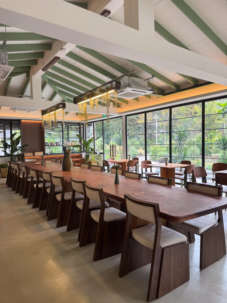 A long communal table sits in the middle of the room. Photo: Shared Table shared table bishan ang mo kio park