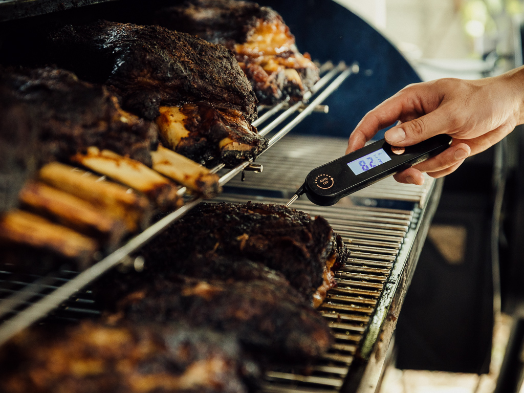 A food thermometer measures the temperature of the meat. Photo: Ravin Thiruchelvam/HungryGoWhere mandai smoke co