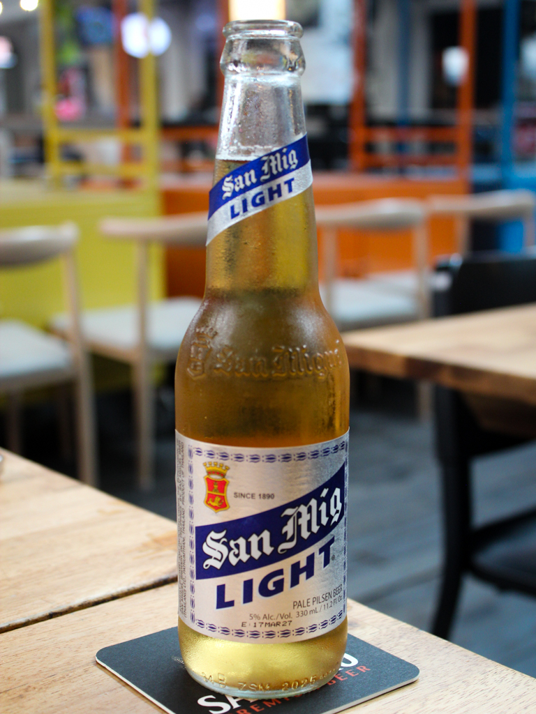 A San Miguel light bottle. Photo: Angeline Ang/HungryGoWhere esquinita by konyo cuppage terrace