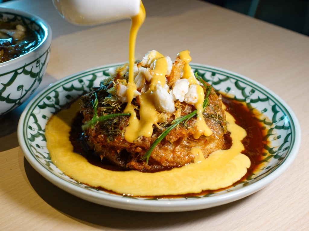 Golden crab tahu kai jeow, doused with a silky egg-yolk sauce. Photo: Sarah Chua/HungryGoWhere im qalb