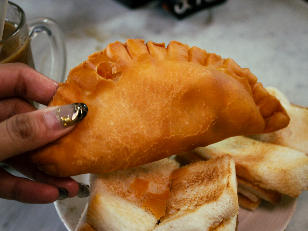 The perfect curry puff has a crunchy exterior that gives way to a generous potato filling. Photo: Angeline Ang/HungryGoWhere heap seng leong coffeeshop