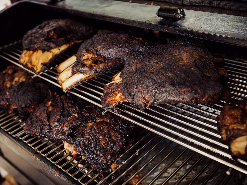 Meats such as the dino short rib (top) and beef short plate (bottom) being smoked. Photo: Ravin Thiruchelvam/HungryGoWhere mandai smoke co