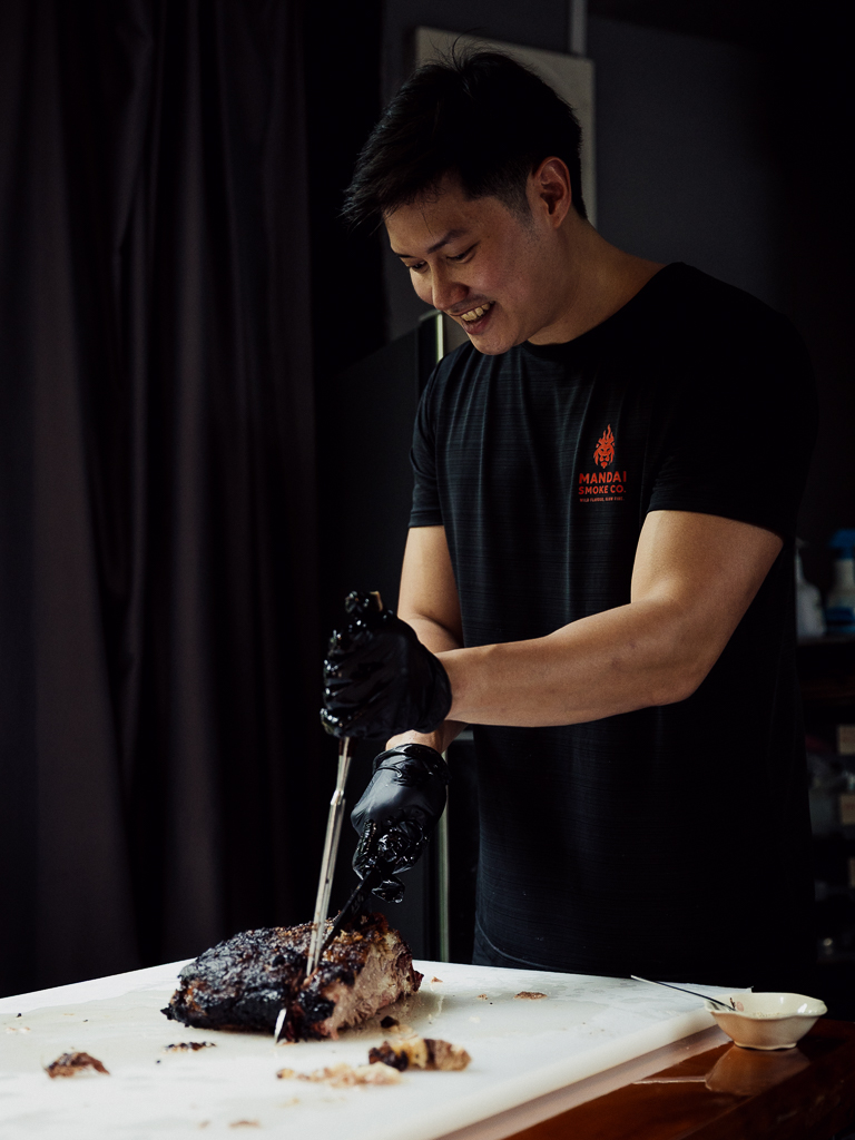 Royston slicing the meats. Photo: Ravin Thiruchelvam/HungryGoWhere mandai smoke co