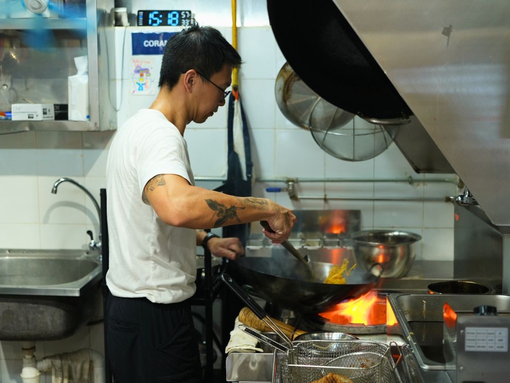 Henry says that his skills at wielding the wok are entirely self-taught! Photo: Shannon Yap/HungryGoWhere woksta abc brickworks