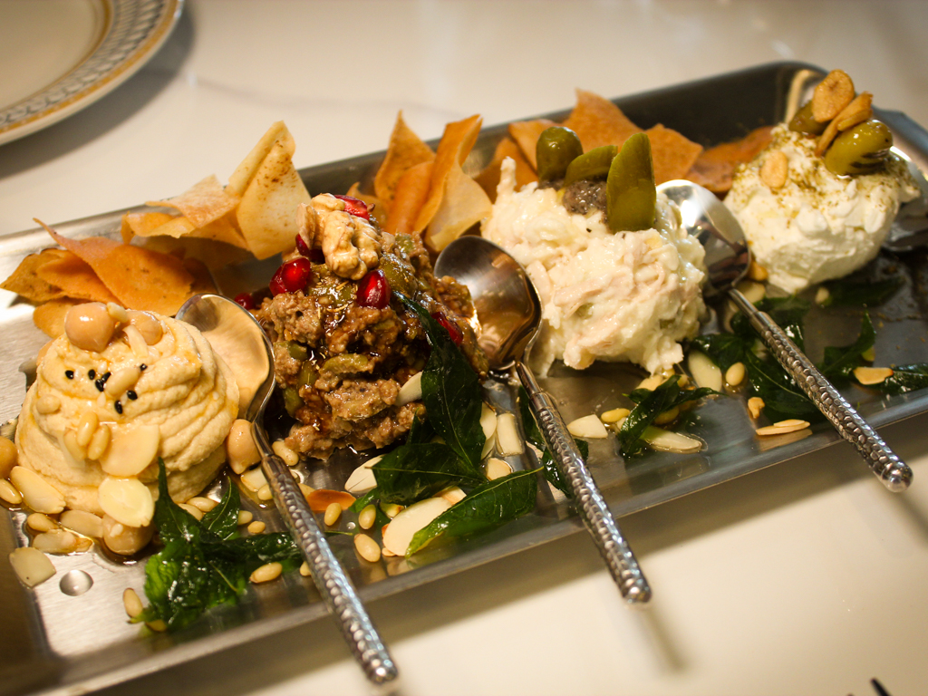 Cold mezze platter. From left: hummus, zeytoon parvardeh, salad olivieh, and labneh. Photo: Angeline Ang/HungryGoWhere shirazi dempsey hill