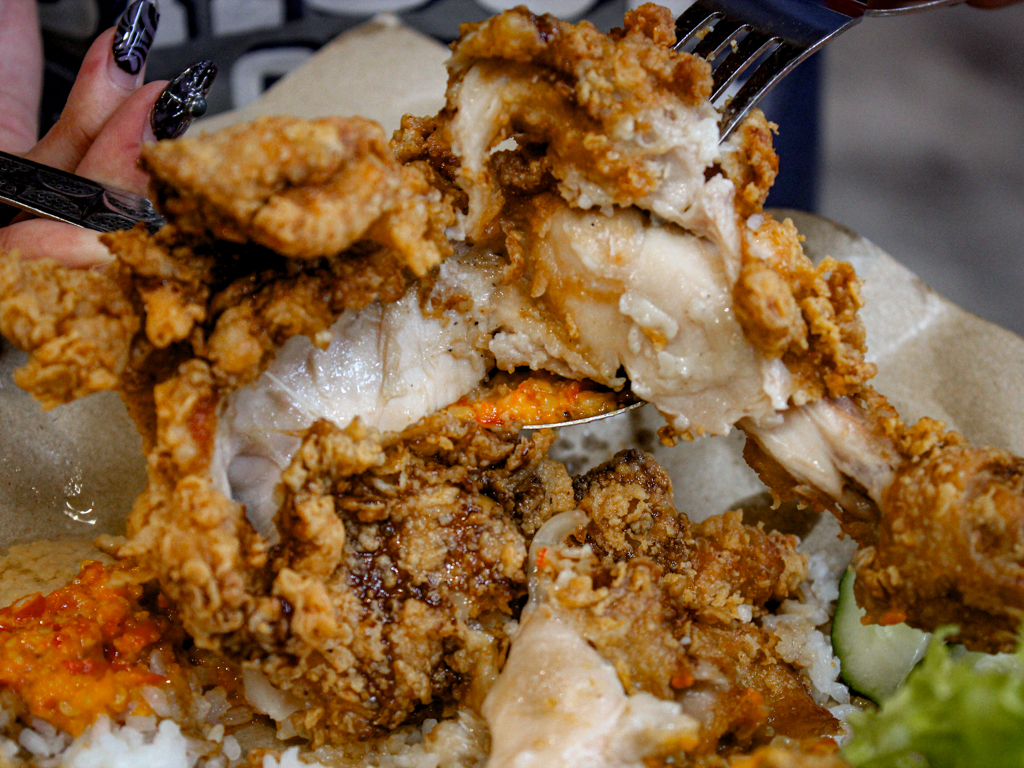 Just look at the golden, crispy skin and juicy meat underneath. Photo courtesy of Hakim Rahman spicy hubby
