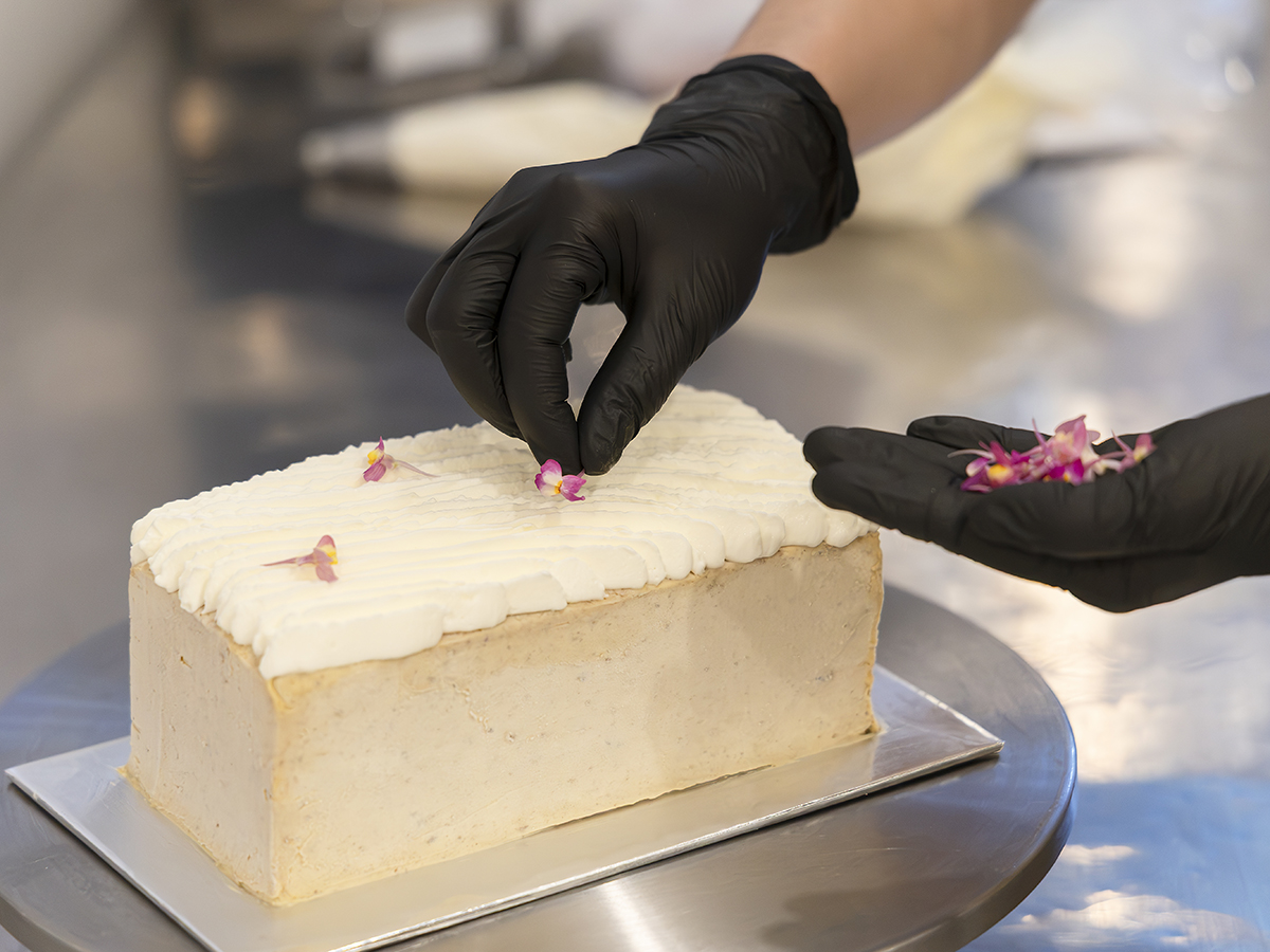 Garnishing a cake. Photo: Koh Mui Fong/HungryGoWhere Cranki Patisserie