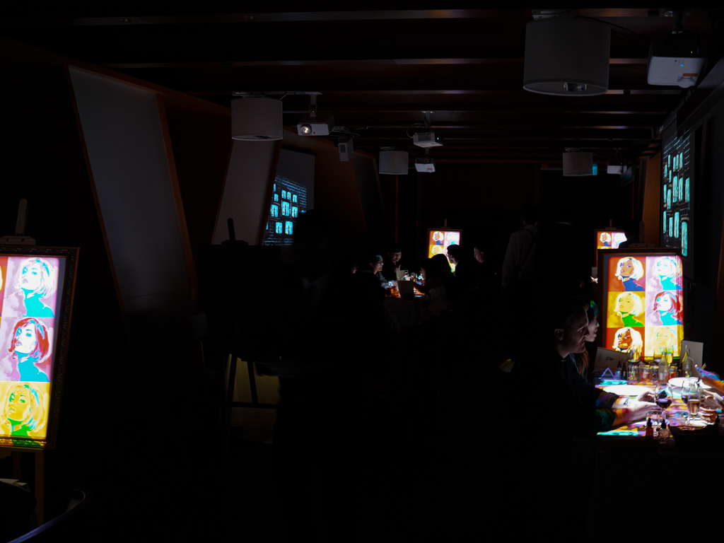 The lights are dimmed for the projections. Photo: Evan Mua/HungryGoWhere 7 paintings singapore