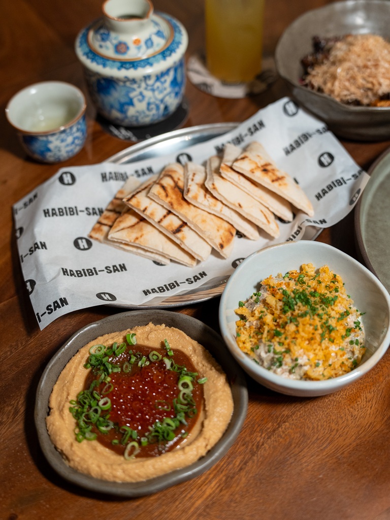 Habibi-san’s pita bread (centre) is best enjoyed with its hummus and babaganoush. Photo: Ewan Lim/HungryGoWhere Grab dine out Jalan Basar